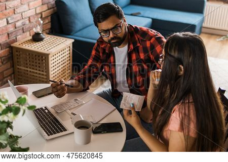 Serious Wife And Husband Planning Budget, Checking Finances, Focused Young Woman Using Online Calcul