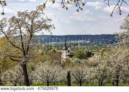Church Of Saint Kilian At Pretzfeld, Germany In Franconian Switzerland Through Twigs And Branches Of