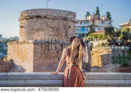 Woman Tourist On Background Of Hidirlik Tower In Antalya Against The Backdrop Of The Mediterranean B