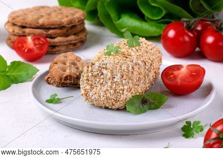 Caboc, Scottish Soft Cheese Made Of Fat Milk, In Oat Grains Served On The Plate