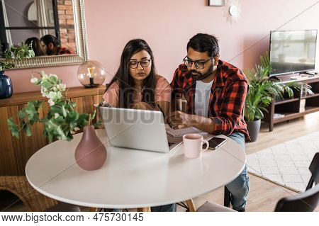 Serious Wife And Husband Planning Budget, Checking Finances, Focused Young Woman Using Online Calcul