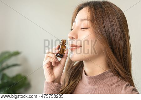 Aromatherapy, Attractive Asian Young Woman, Girl Face Expression Enjoying Smell Fragrance Of Herbal 