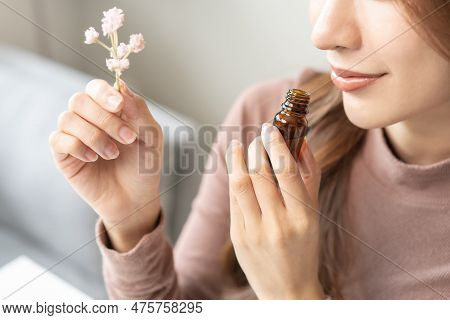 Aromatherapy, Asian Young Woman, Girl Hand Holding Flower, Bottle Of Essential Perfume Oil, Enjoying