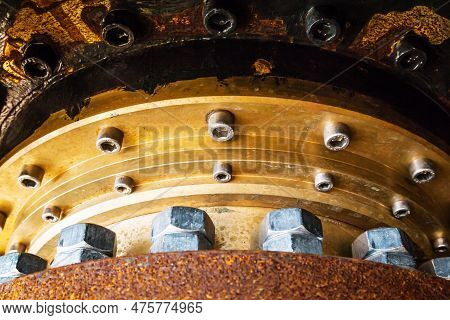 Large Bolted Connection. Basis For Attaching An Azimuth Thruster On A Ship. Bolts And Nuts Are Screw
