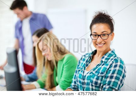education concept - student with computer studying at school