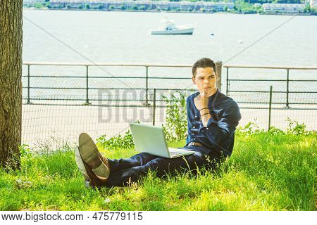 Businessman Traveling, Working In New York. Wearing Blue Collarless Shirt, A College Student Sitting