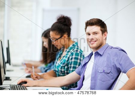 education concept - student with computer studying at school