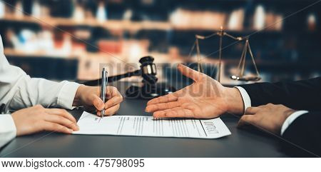 Lawyer Signing Contract, Professional Lawyer In Law Firm Library Drafting Legal Document Or Contract