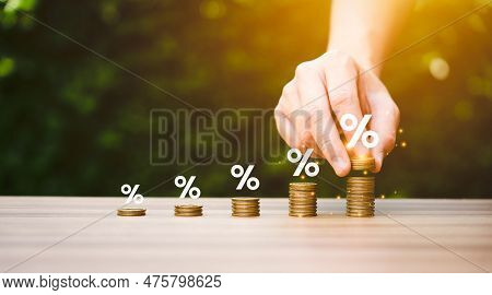 Higher Interest Rates And Dividends, Pile Of Coins And Percentage Of Company Profits. Saving Money F