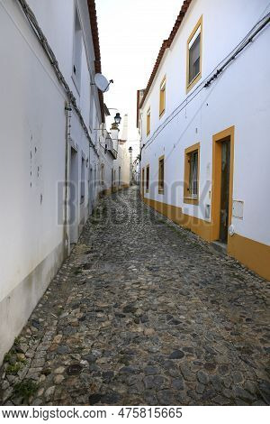 Evora, Portugal- October 10, 2022:typical Portuguese Facades And Cobblestone Streets In Evora Town, 