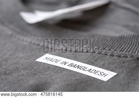 Black T-shirt With Words Made In Bangladesh, Close Up. Production Of Clothes In South Asia, Cheep, A