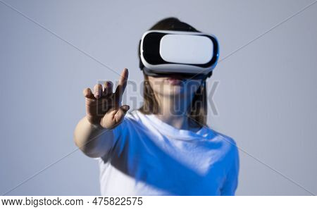 Young Brunette Woman In Vr Glasses And Workung In Virtual Simulated World. Future Technology Digital