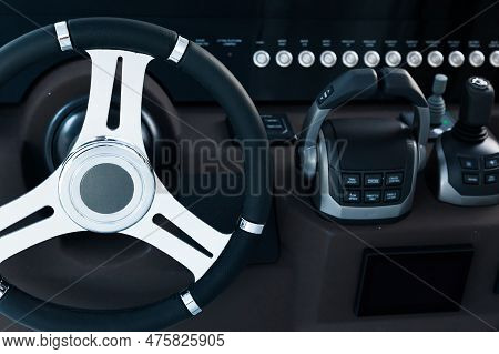 Motor Yacht Control Panel. Steering Wheel, Gear Levers, Control Buttons. Navigation Bar For Luxury Y