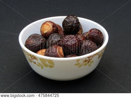 Sapindus Mukorossi Or Indian Soapberry In A Bowl On Black Background