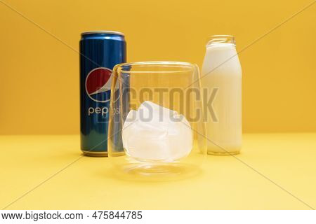 Closeup Pilk Preparing, Trendy Pepsi Milk Drink. Combining Soda And Dairy Beverages. Bottle Of Milk 
