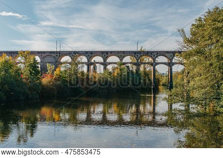 Railway Bridge With River In Bietigheim-bissingen, Germany. Autumn. Railway Viaduct Over The Enz Riv
