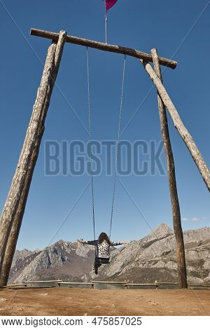 Huge Swing Surrounded By Mountains In Riano Village. Spain