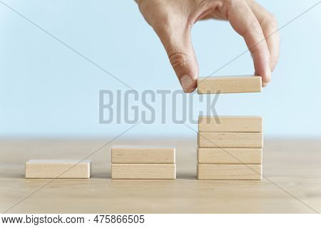 Growth, Target, Upskill Concept. Growth Of Wooden Cubes On A Clean Background. Business, Economics, 