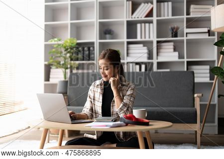 Happy Accounting At Home. Cheerful Smiling Soman Using Laptop Computer And Calculator, Filling Tax F