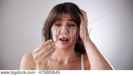 Hairfall And Hairloss. Worried Woman With Hair Loss