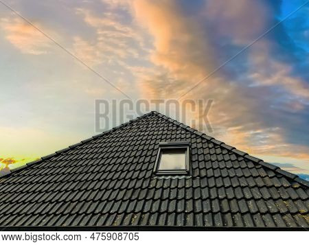 Open Roof Window In Velux Style With Black Roof Tiles.
