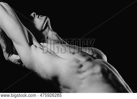 Seductive Gay. Muscular Body Of Man On Black Background. Strong Brutal Guy. Sexy Torso. Male Flexing