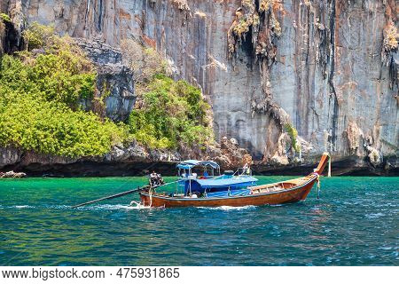 Old Traditional Thai Motorboat Made Of Wood For Fishing And Tourists On Excursions In The Andaman Se