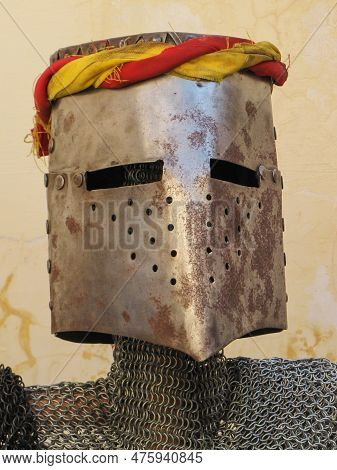 A Striking Image Of A Metallic Knight Helmet