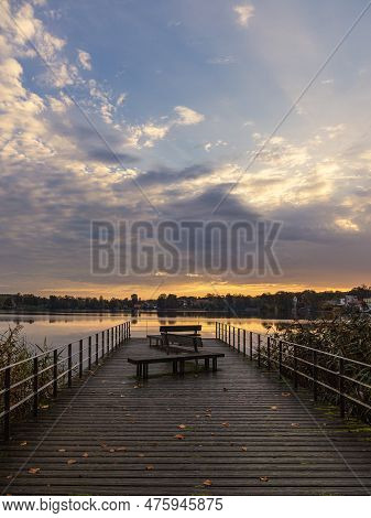 Sunrise And Landing Stage On The Lake Haussee In The City Feldberg, Germany.