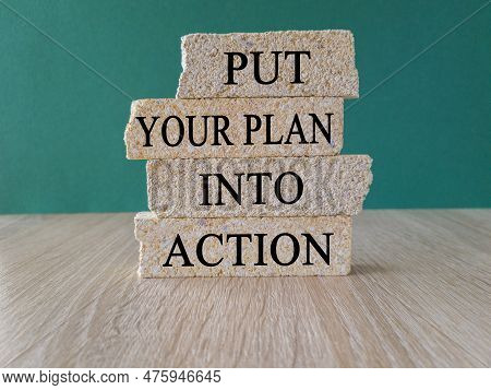 Put Your Plan Into Action Symbol. Concept Words Put Your Plan Into Action Typed On Brick Blocks. Bea