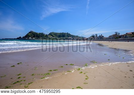 View On Playa De Ribadesella, Green Coast Of Asturias, North Spain With Sandy Beaches, Cliffs, Hidde