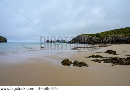 View On Playa De Borizo In Celorio, Green Coast Of Asturias, North Spain With Sandy Beaches, Cliffs,