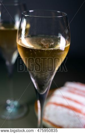 Glasses Of Sparkling White Wine Champagne Or Cava With Bubbles And Sweet Dessert Reims Rose Biscuits