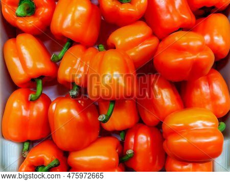 Large Quantity Of Loose Red Peppers With Green Caps