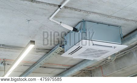 Industrial Air Conditioner In The Office On A Concrete Ceiling.
