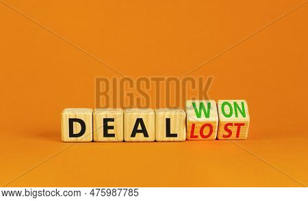 Deal Lost Or Won Symbol. Businessman Turns Wooden Cubes And Changes Words Deal Lost To Deal Won. Bea