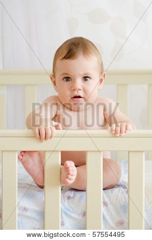 Baby Sitting In A Crib