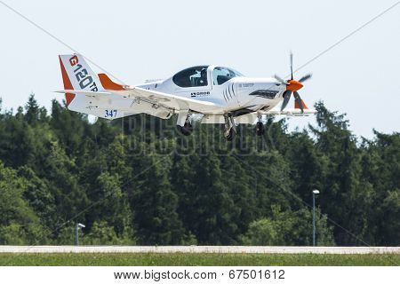 BERLIN, GERMANY - MAY 20, 2014: Two seated training and aerobatic low-wing aircraft Grob G120 TR (Germany), demonstration during the International Aerospace Exhibition ILA Berlin Air Show.