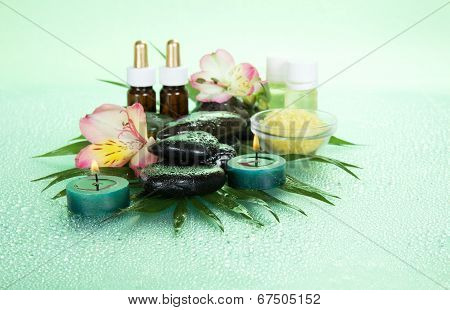 Candles and aroma oil, salt, stones, flower