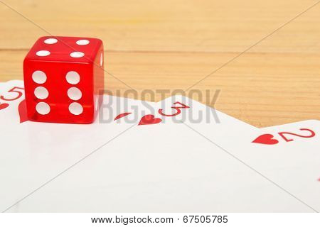 Poker cards and red dice