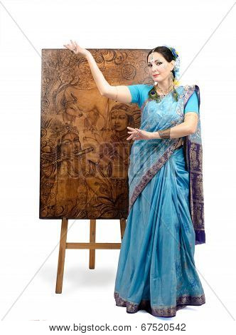 Artist In Indian Sari Posing With Pyrography Painting Lotus