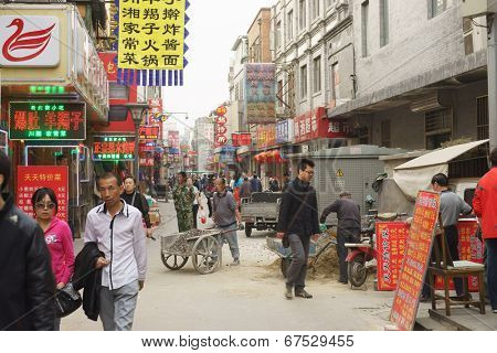 BEIJING - APRIL 27: Tourists and shoppers line Qianmen Street on April 27, 2013 in Beijing, China. Qianmen Street is a famous tourists place in Beijing