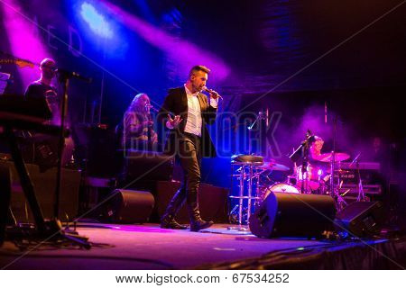 LOULE - JUNE 26: Ala dos Namorados, traditional band from Portugal, performs on stage at festival med, a world music festival, in Loule, Portugal, June 26, 2014 