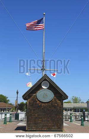 American flag and nautical flags flying at Woodcleft Esplanade in Freeport, Long Island