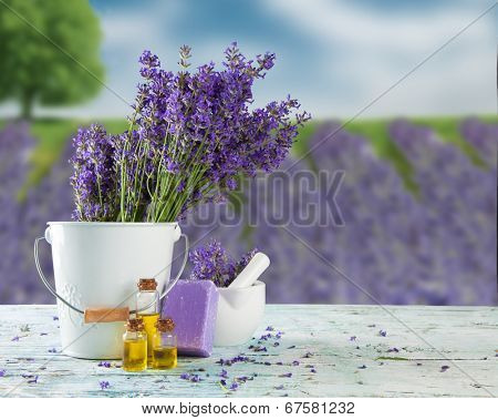 Harvested lavender flowers on wooden planks, blur field on background