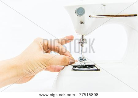 A woman with Sewing Machine isolated