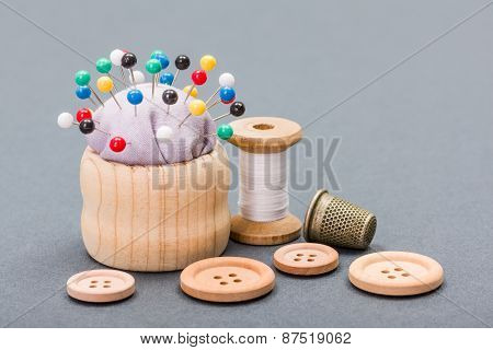 Thread, Buttons, Thimble And Pincushion