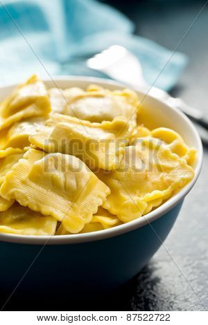 cooked ravioli in bowl on kitchen table