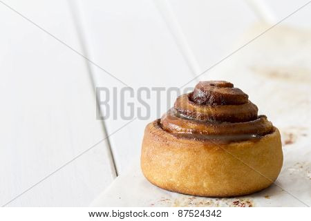 Cinnamon Rolls with Caramel Glaze on Baking Paper