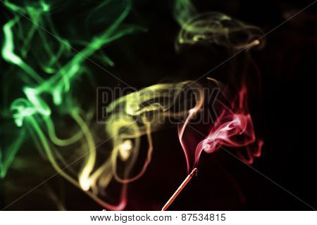 colored smoke on a black background
